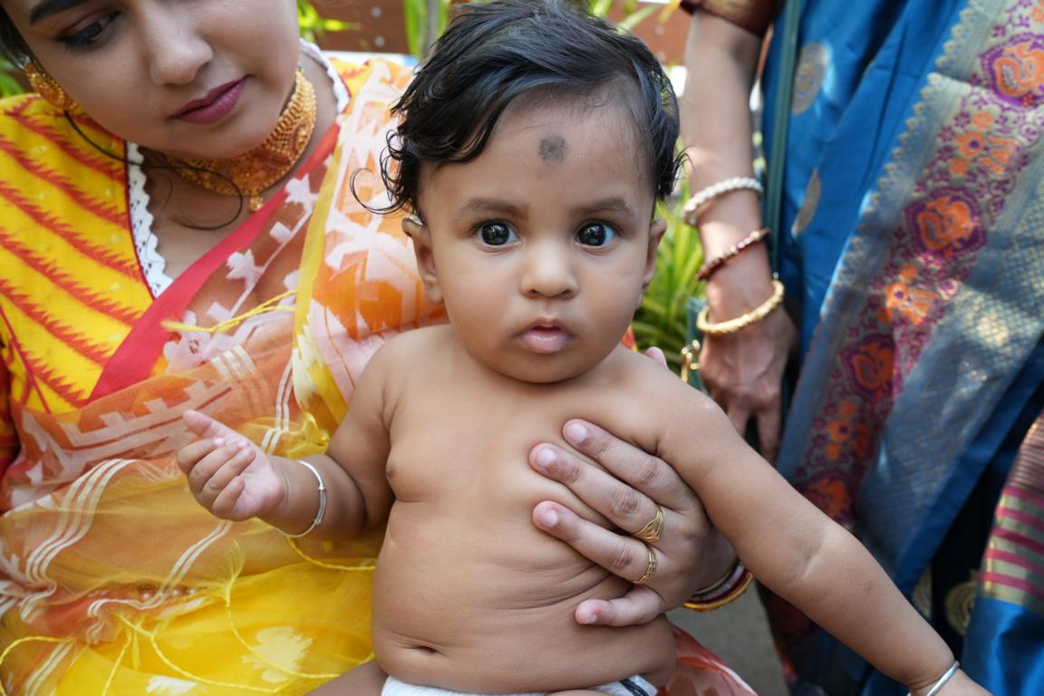 Baby annaprasan photo in traditional attire captured in Kolkata by Santanuz Gallery.