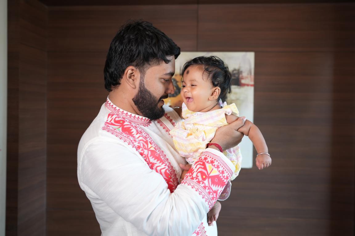 Baby annaprasan photo in traditional attire captured in Kolkata by Santanuz Gallery.