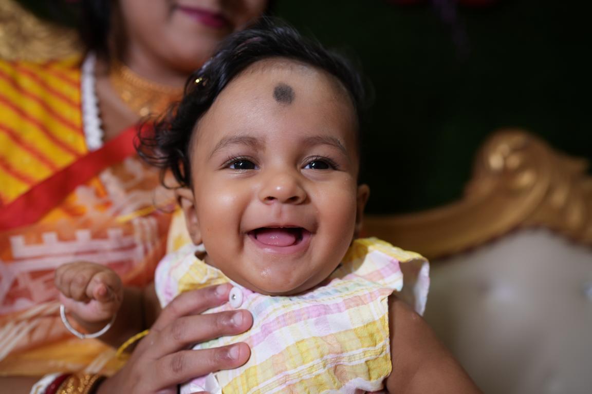 Candid moments from baby’s first rice ceremony in Kolkata by Santanuz Gallery.