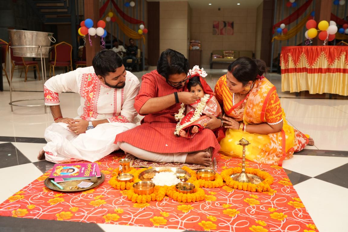 Candid moments from baby’s first rice ceremony in Kolkata by Santanuz Gallery.