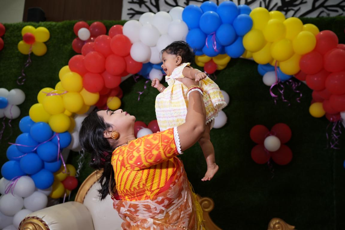 Baby annaprasan photo with parents in Kolkata by Santanuz Gallery.