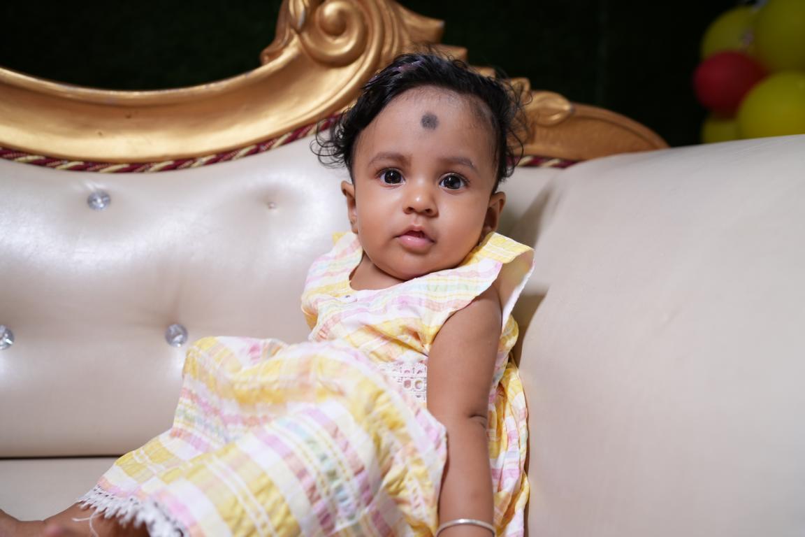 Baby annaprasan photo with parents in Kolkata by Santanuz Gallery.