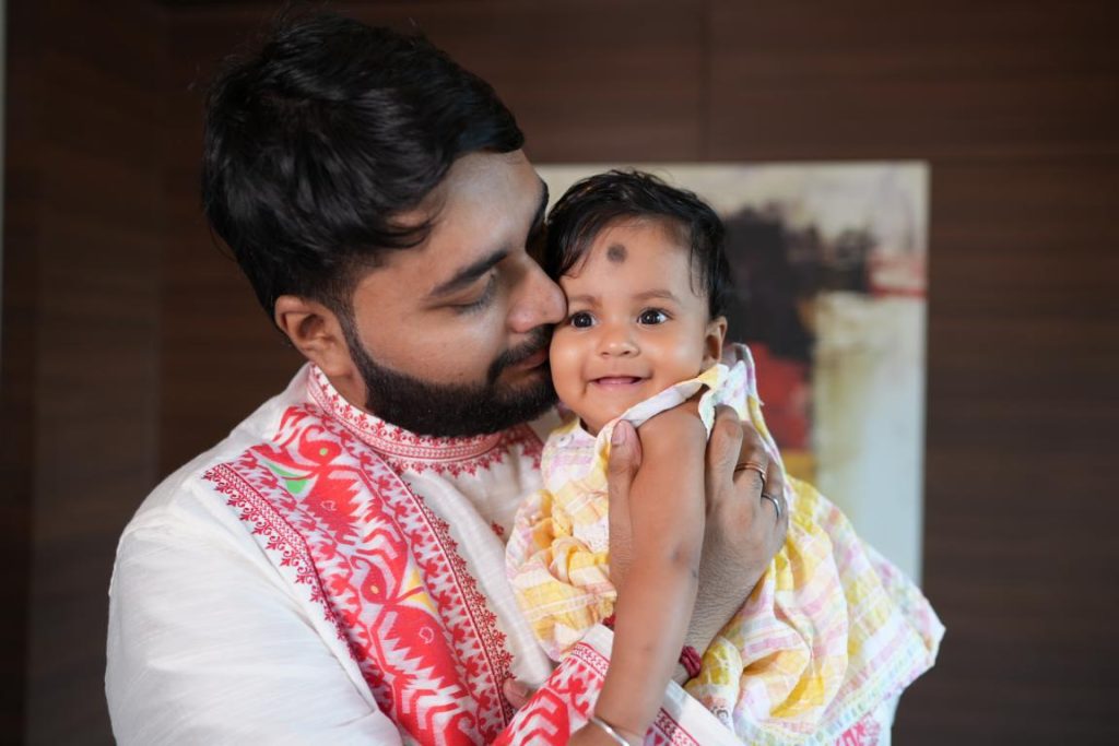 Top-rated Rice Ceremony Photographer Kolkata capturing cute baby expressions during rice ceremony.