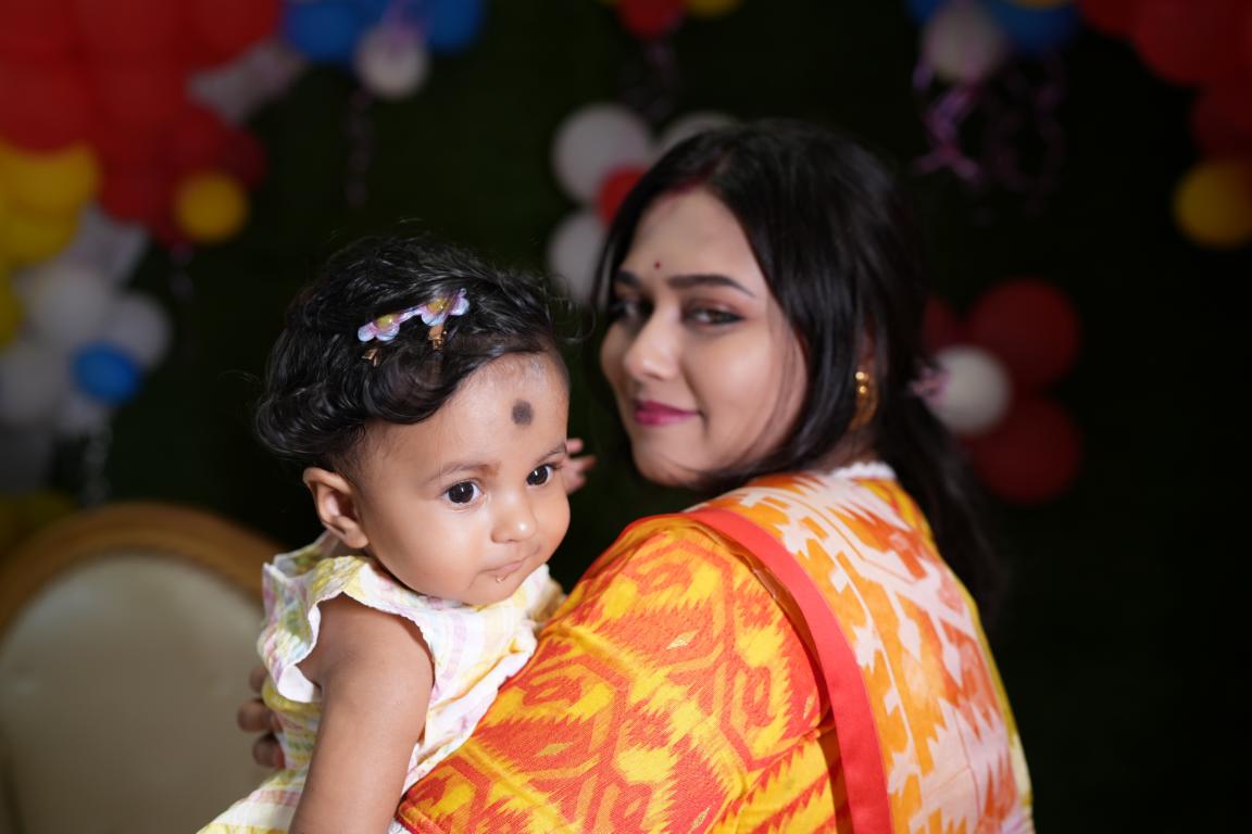 Family portrait during annaprasan ceremony in Kolkata by Santanuz Gallery.