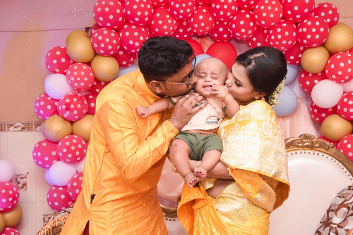 Family portrait during annaprasan ceremony in Kolkata by Santanuz Gallery.