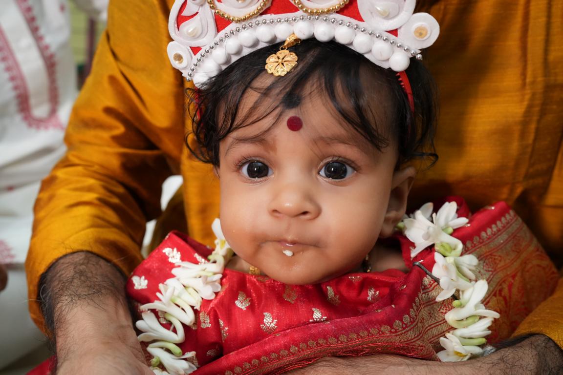 Family portrait during annaprasan ceremony in Kolkata by Santanuz Gallery.