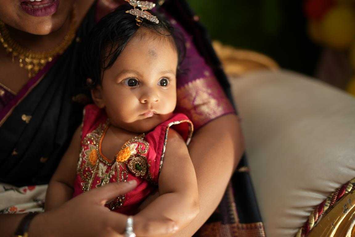 Candid baby annaprasan photography captured in Kolkata by Santanuz Gallery.
