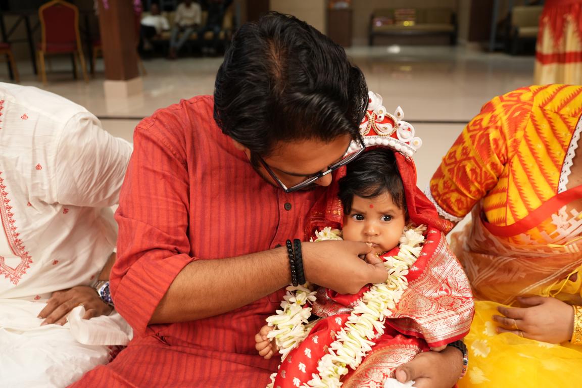 Candid baby annaprasan photography captured in Kolkata by Santanuz Gallery.