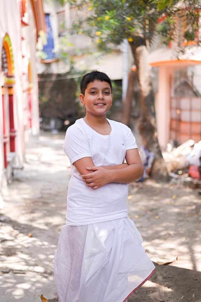 “Sacred thread wearing moment during upanayan vidhi”