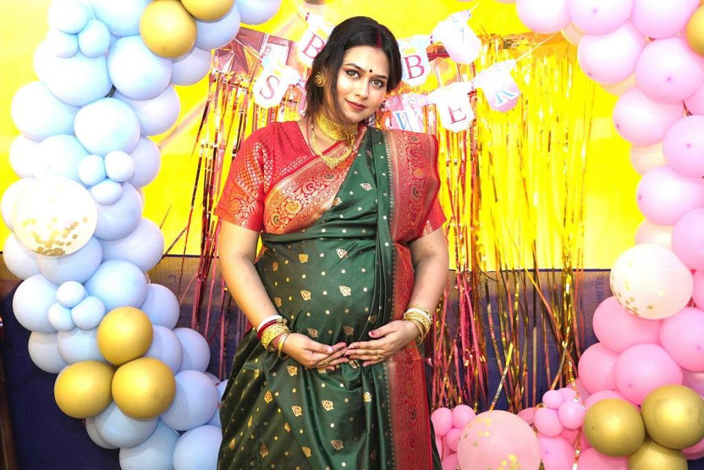 Traditional Payash feeding ritual in Bengali Sadh Bhakshan