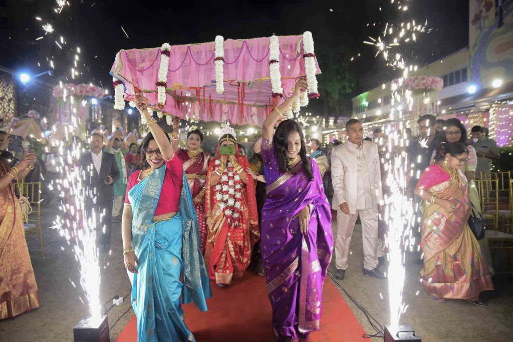 Traditional Holud Kota ritual in Bengali wedding ceremony