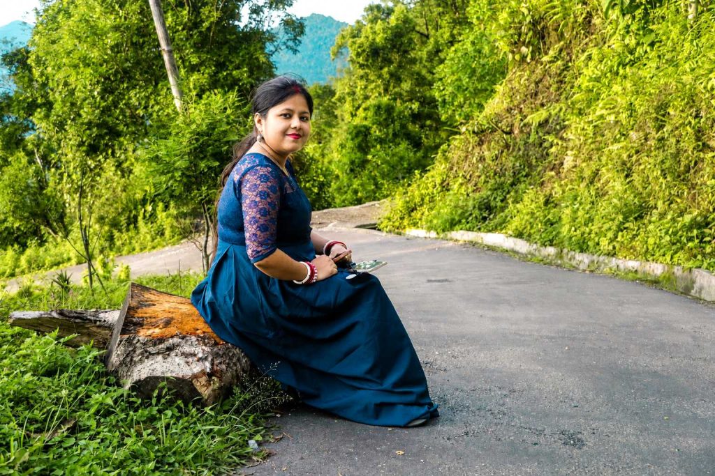 Outdoor post wedding photoshoot of a couple in a scenic hill station